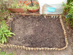 potager...<br />on le voit pas sur la photo mais il y a des trucs qui pousse mais je sais pas trop ce que c'est...